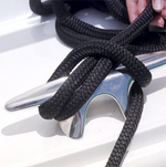 Fatsac dock line secured around a silver cleat on a white surface.
